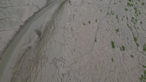 Flying-over-the-sandy-lifeless-beach-of-the-Heswall-coastline