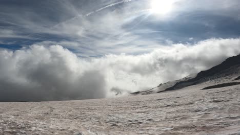 Panning-view-from-high-up-on-Mount-Rainier-showing-the-altitude-of-the-mountain-is-above-the-clouds