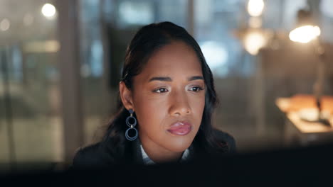 Reading,-thinking-and-woman-at-computer-in-office