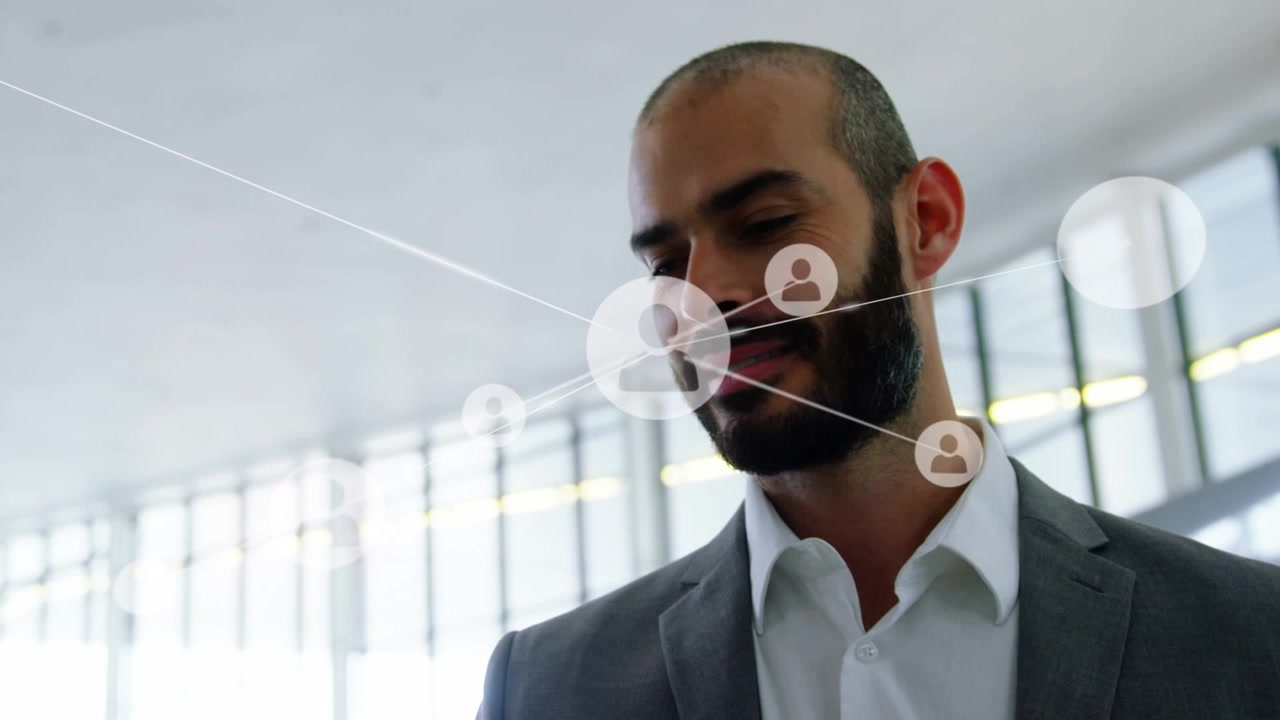 Businessman Walking Through Modern Office with Digital Network Overlay