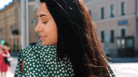 smiling woman in a city street