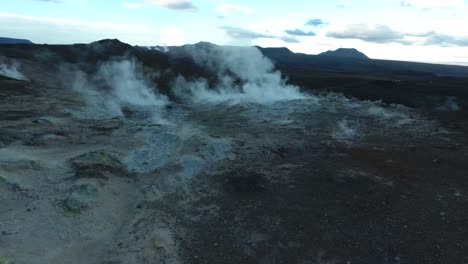 amazing drone shot over sulfur vapors in namafjall hverarond, geysers, mud pits