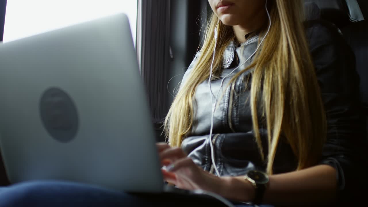 Woman Working Online when Sitting in Taxi