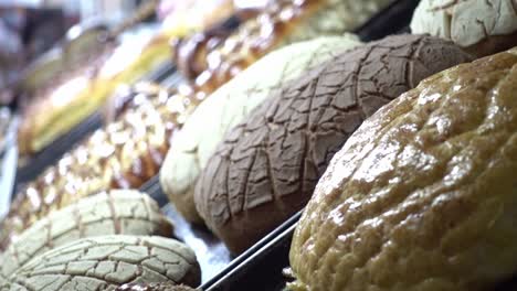 Close-up-shot-over-some-different-delicious-breads-in-a-counter