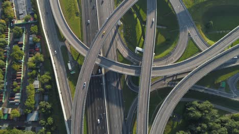 multi-level road junction and cars traffic. camera is tilting up. aerial vertical shot.