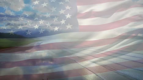 digital composition of waving us flag against aerial view of the beach