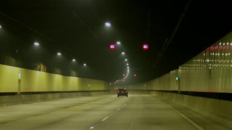 pov car driving through a long tunnel, sydney australia