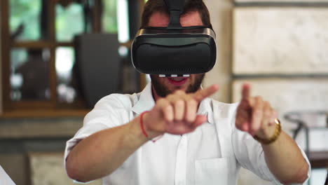 Team-of-developers-working-with-virtual-reality-glasses-during-a-business-meeting.-Young-business-colleagues-brainstorming-using-VR-goggles