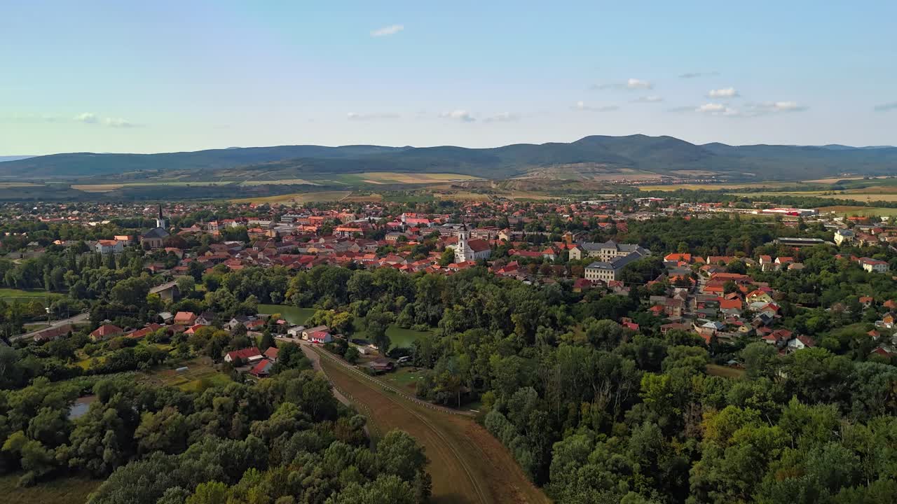 Orbital hyperlapse around Sárospatak downtown between the Bodrog River and Zemplén Mountains in the background in Hungary