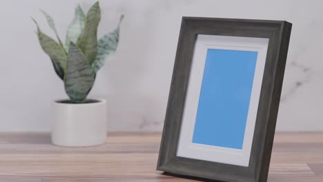 black frame with blue screen on white background | 4k