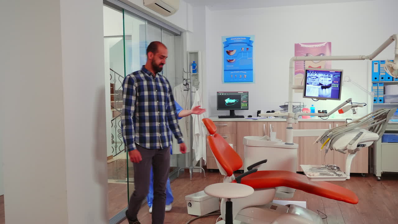 Nurse inviting patient in stomatology room showing to lie on chair