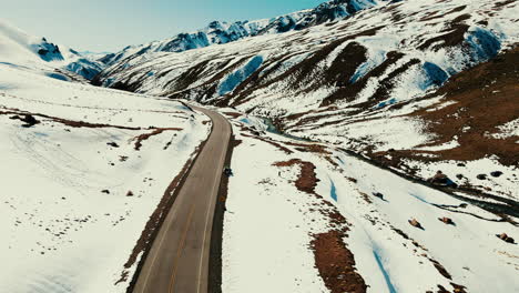 A-bird's-eye-panorama-unfolds-over-Paso-Pehuenche,-nestled-in-the-heart-of-the-Andes