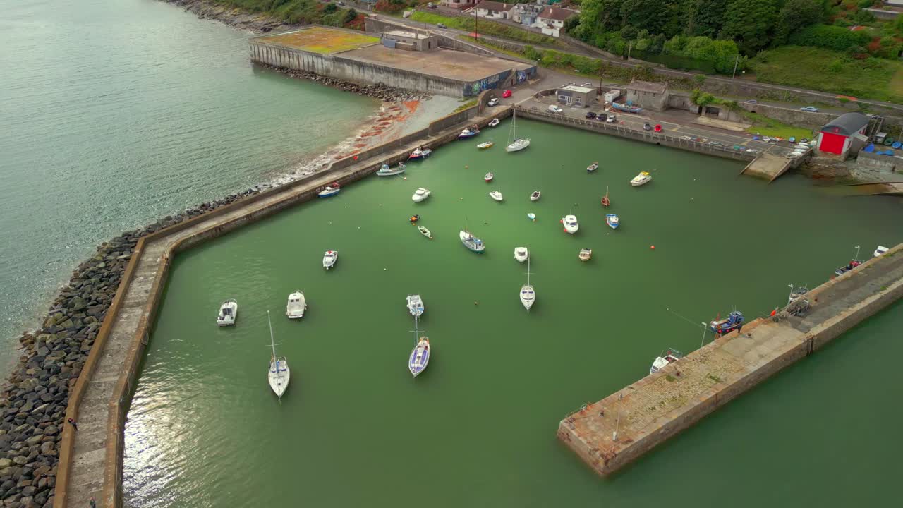 Wide to close-up aerial video of Newcastle Harbour in County Down, Northern Ireland. Filmed in 4K, 60FPS and with Rec709 color
