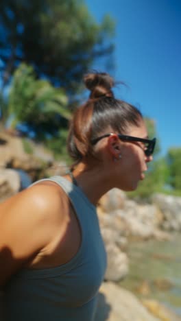 young woman in casual outfit and sunglasses outdoors