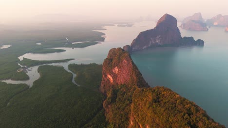 thailand aerial overview of phang nga bay at sunset, enchanted seascape with limestone mountains calm meditative mother earth drone footage