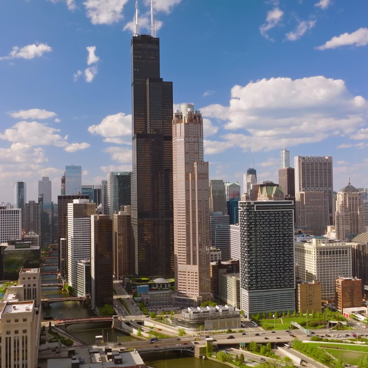 Sunny day in Chicago city, Illinois. Startling metropolis architecture at the backdrop of blue sky