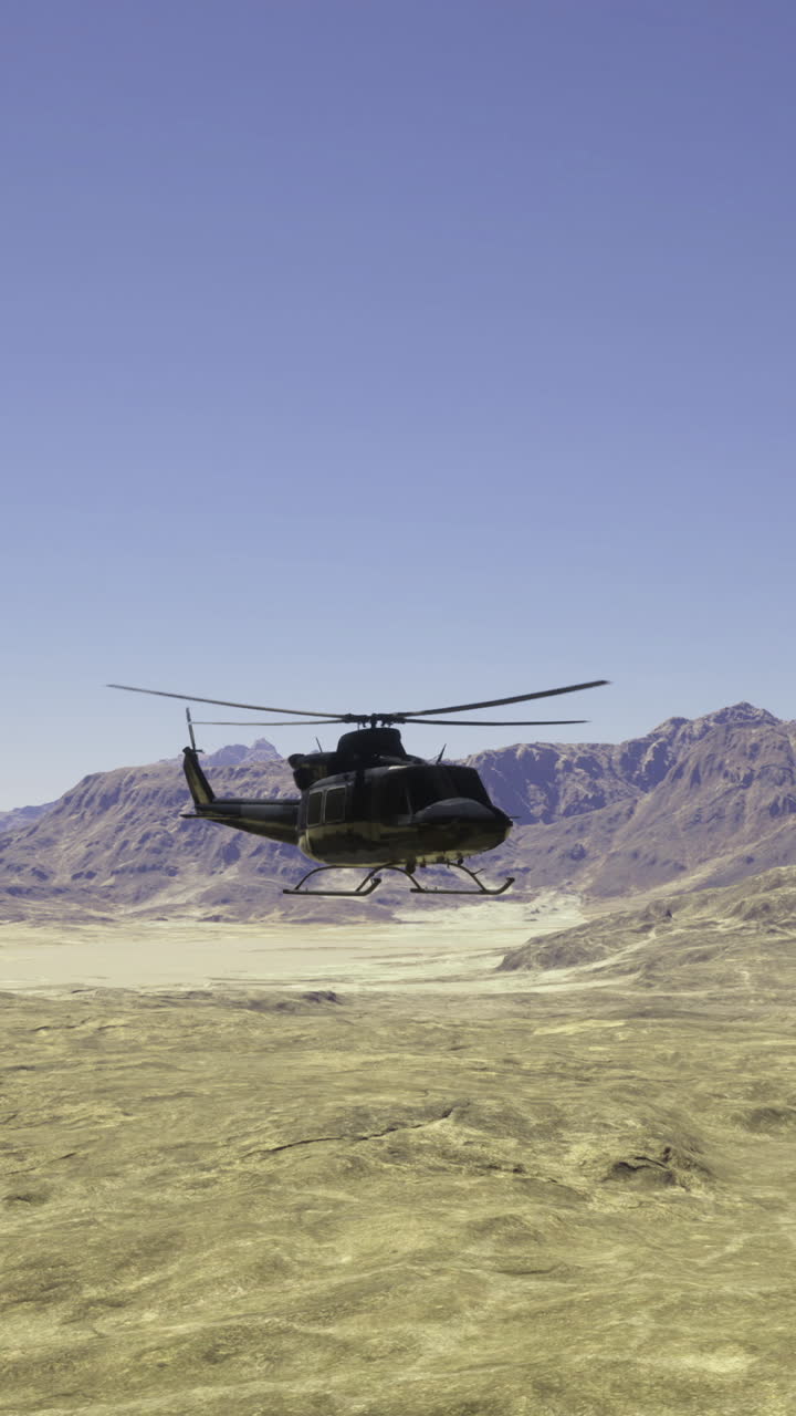 Helicopter flying over rugged mountains in a clear desert landscape