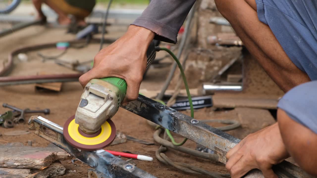 Man grinding and polishing metal professional