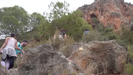 hikers group walk along a rout in the mountain