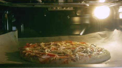 pizza baking in oven