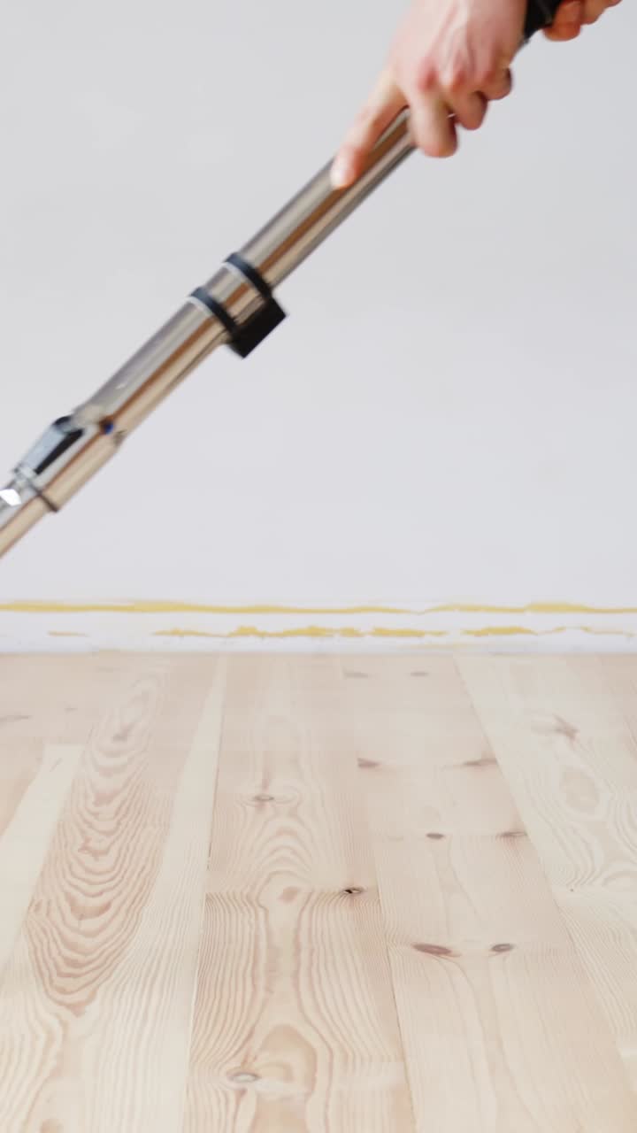 Smooth floor sanding process, DIY home renovation, calm and focused, vertical