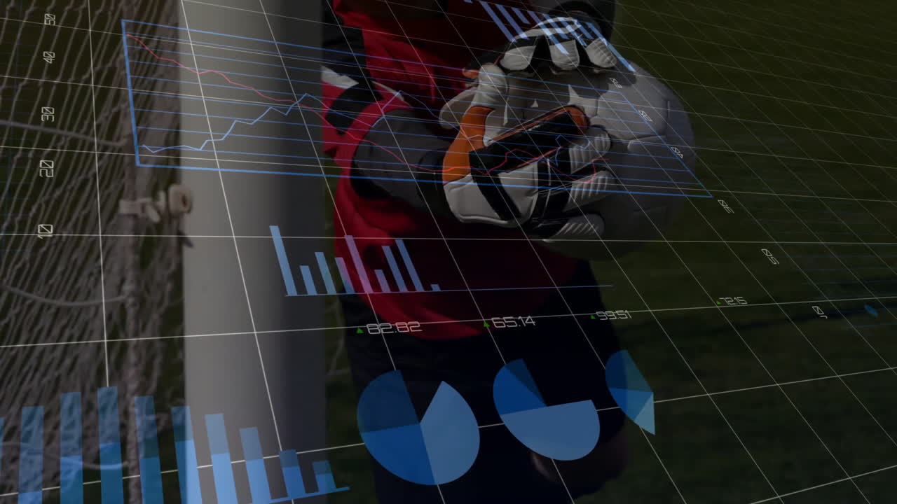 Catching soccer ball, goalkeeper in school with animation of data graphs overlayed