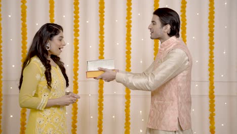 indian man surprising his wife on diwali