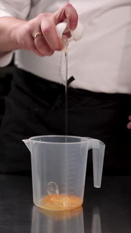 chef separating egg yolks and whites