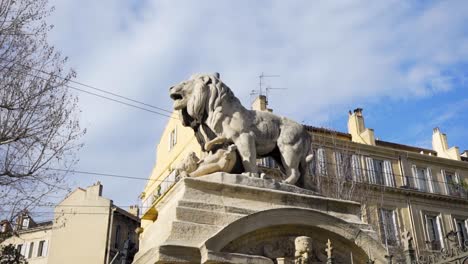 lion statue on a building in a european city