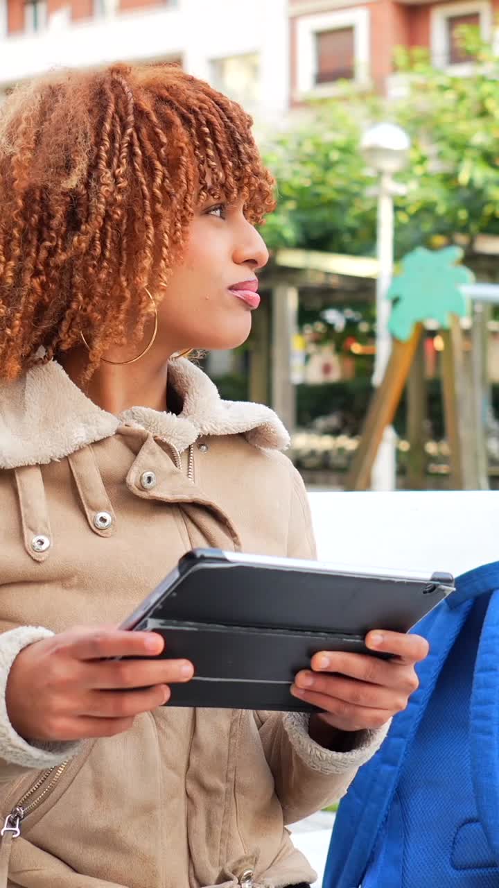 Woman with Tablet in Park