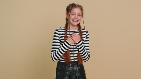 happy excited child girl laughing out loud after hearing ridiculous anecdote reaction on funny joke