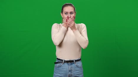 young ill woman feeling nausea closing mouth with hands. portrait of unwell sick caucasian lady posing at green screen chromakey background. pregnancy and food poisoning concept