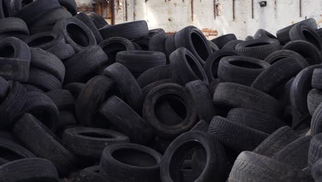 old tires at a dump, close up. pile of used tires lays at a special dump