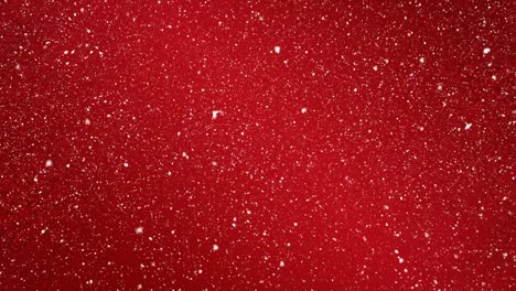 Animation-of-snow-falling-over-red-background