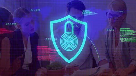 security shield animation over diverse business team discussing documents at office