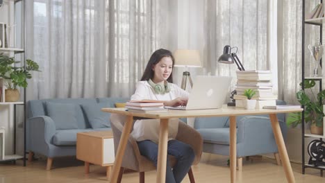 teenage girl studying at home