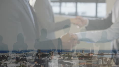 animation of businessman handshake over cityscape