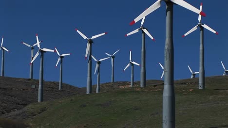 mediumshot of several wind turbines generating power at tehachapi california 3