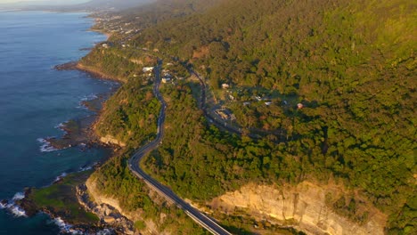 Beautiful-Lush-Green-Forest-And-Turquoise-Sea-In-NSW-Australia---aerial-shot