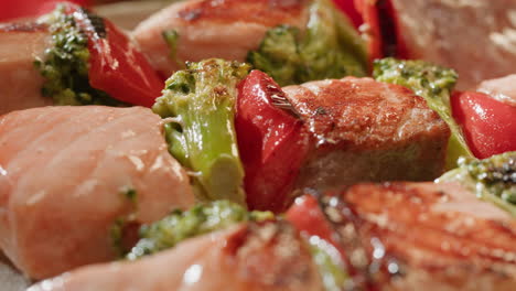 grilled salmon skewers with broccoli and peppers