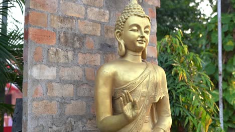 cinematic parallax shot of buddha statue kept in outdoor location