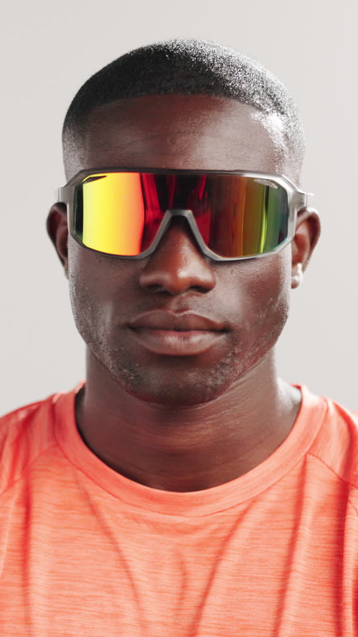 Close-up Portrait of Young Man Wearing Reflective Sports Sunglasses