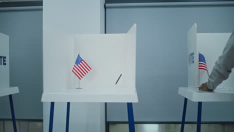 dolly shot of diverse american citizens voting in booths dolly shot of diverse american citizens voting in booths in polling station office national election day in the united states political races of us presidential candidates concept of civic duty