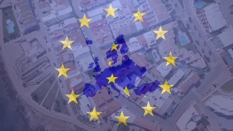 Map-of-EU-with-yellow-stars-spinning-against-aerial-view-of-cityscape