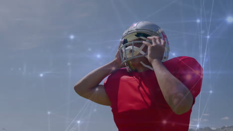 jugador de fútbol ajustando el casco, conexiones de red animación sobre el cielo azul