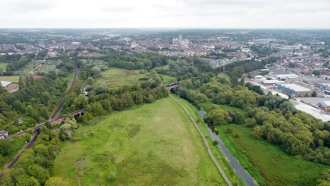 aerial over hambrook marsh with train going past towards canterbury east