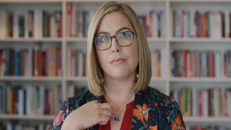 portrait-beautiful-young-blonde-woman-looking-pensive-intelligent-professional-female-contemplating-wearing-glasses-in-library-slow-motion