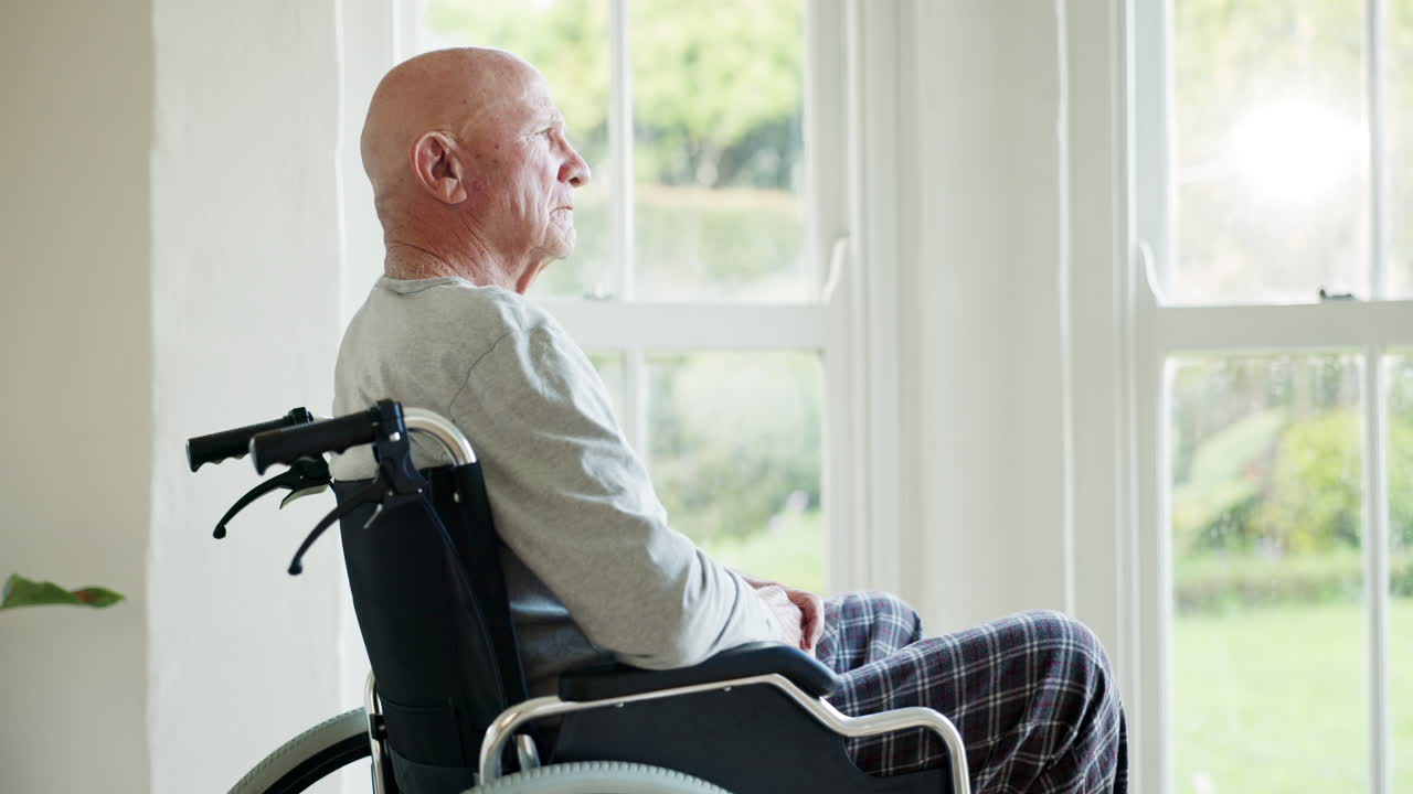 Senior man, thinking and wheelchair by window