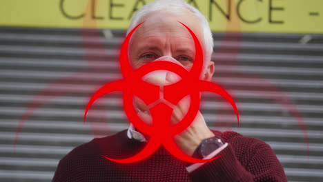 animation of biohazard symbol, over man in face mask in city street