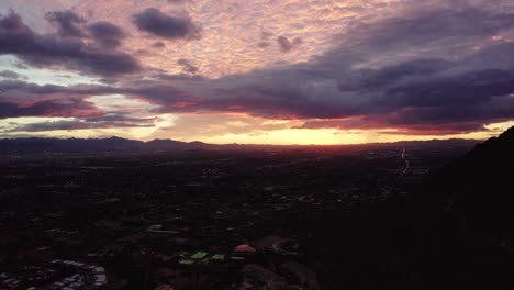 sun setting over phoenix, arizona with bright colors overhead